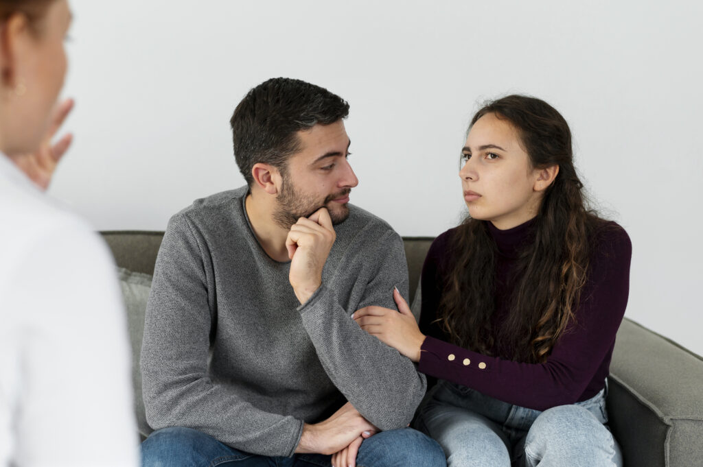Couple discussing relationship problems with a therapist during a couples counseling session
