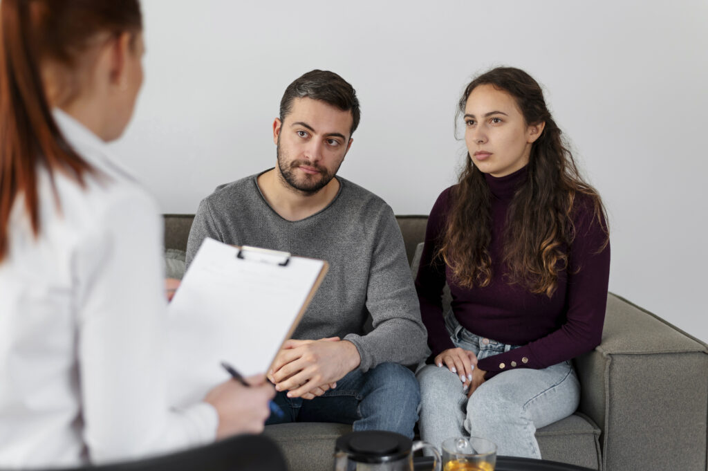 Couple talking with a therapist during a couples therapy session