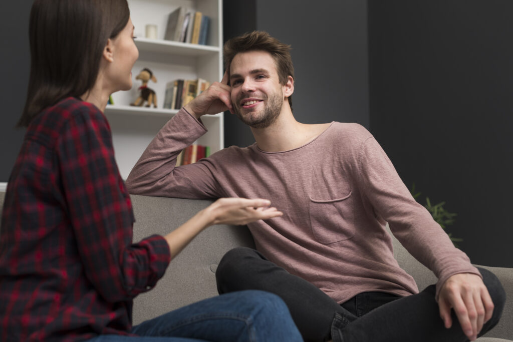 Couple discussing relationship concerns during a conversation.