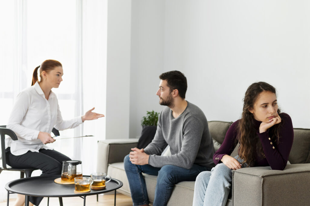 Couple discussing relationship and family concerns during a therapy session.