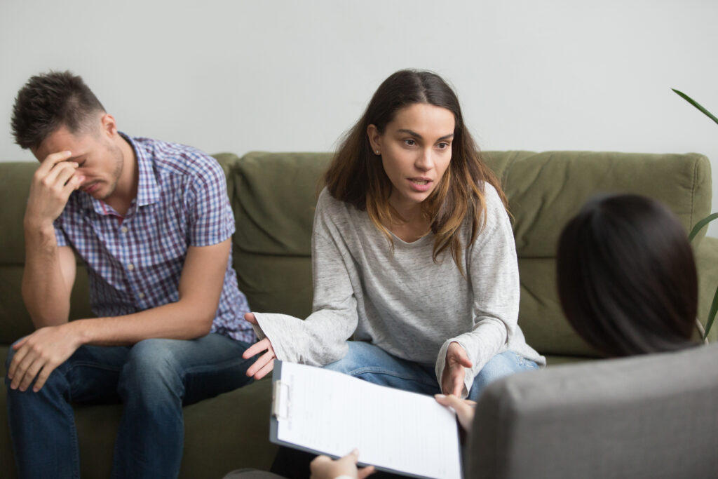 Couple discussing relationship difficulties with a therapist